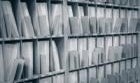 Letters lined up in a mailroom stamped by a postage meter