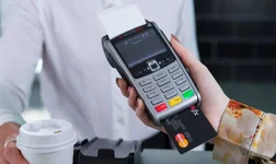 Woman holding a card reader