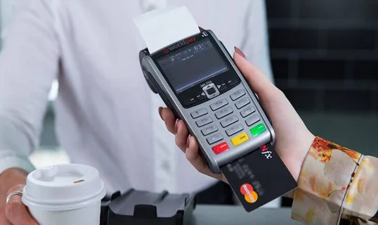 Woman holding a card reader