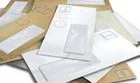 Pile of white and brown envelopes