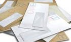 Pile of white and brown envelopes