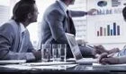 Office workers discussing growth in a meeting