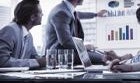 Office workers discussing growth in a meeting